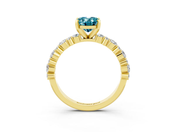 Yellow gold Oval Cut Blue Topaz Side Stone Solitaire Ring with Round  and Four-Prong Setting