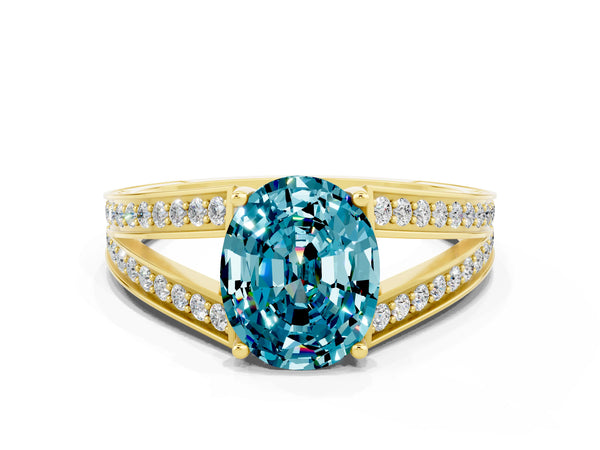 Yellow gold Oval Cut Blue Topaz Split Shank Ring with Pavé Band and Four-Prong Setting