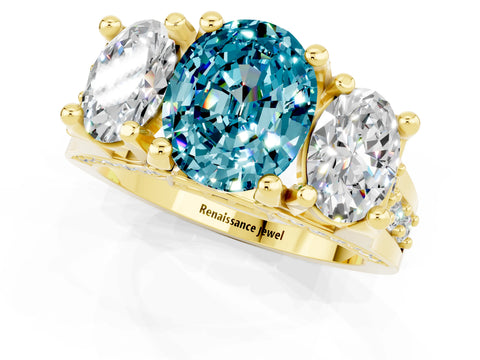 Yellow gold Oval Cut Blue Topaz Three-Stone Ring with Channel Set Band and Four-Prong Setting_1
