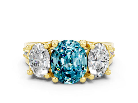 Yellow gold Oval Cut Blue Topaz Three-Stone Ring with Channel Set Band and Four-Prong Setting