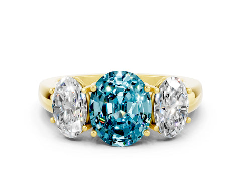 Yellow gold Oval Cut Blue Topaz Three-Stone Ring with Four-Prong Setting and Classic Band