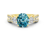 Yellow gold Oval Cut Blue Topaz Three-Stone Ring with Pavé Split Shank and Four-Prong Setting_12