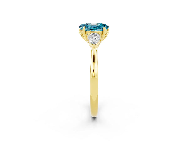 Yellow gold Oval Cut Blue Topaz Three-Stone Ring with Pear  Side Stones and Prong Setting