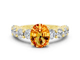 Yellow gold Oval Cut Citrine Prong Setting with Side Stones on a Pave Band