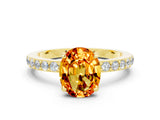 Yellow gold Oval Cut Citrine Solitaire Engagement Ring with Pavé Band and Four-Prong Setting