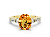 Yellow gold Oval Cut Citrine Solitaire with Side Baguettes and Channel Set Band