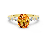 Yellow gold Oval Cut Citrine Solitaire with Side Stones on a Pavé Band and Four-Prong Setting
