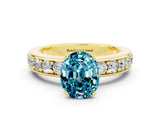 Yellow gold Oval Cut Cut Channel Set Diamond Engagement Ring with Four-Prong Setting