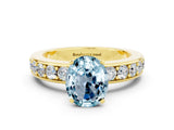 Yellow gold Oval Cut Cut Channel Set Diamond Engagement Ring with Four-Prong Setting