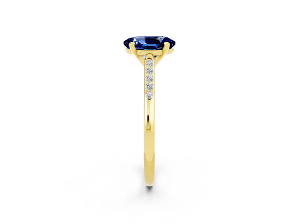 Yellow gold Oval Cut Blue Sapphire Solitaire Ring with Channel Set Round Band and Prong Setting