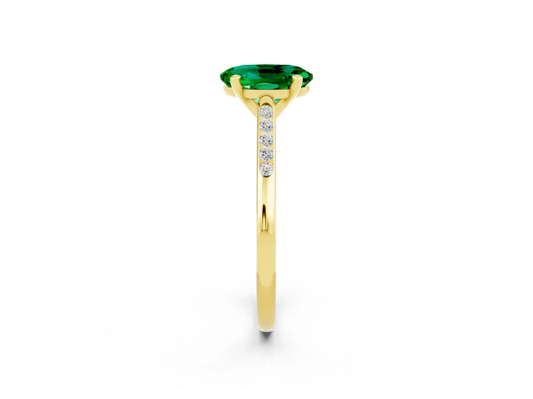 Yellow gold Oval Cut Emerald Solitaire Ring with Channel Set Round Band and Prong Setting