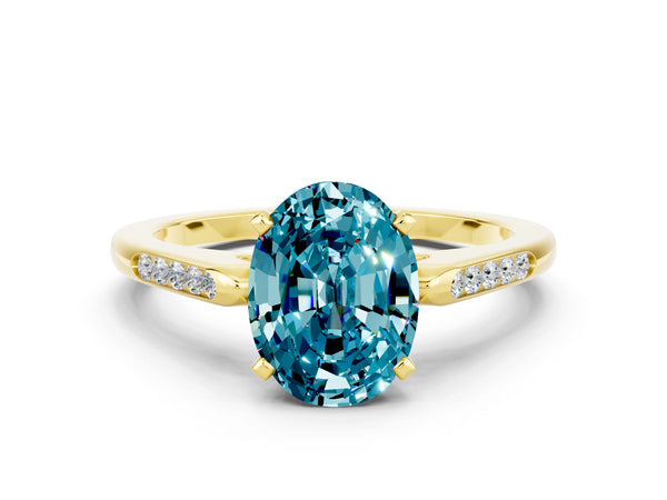 Yellow gold Oval Cut Blue Topaz Solitaire Ring with Channel Set Round Band and Prong Setting