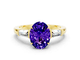 Yellow gold Oval Cut Cut Diamond Ring with Tapered Baguette Side Stones in Four-Prong Setting