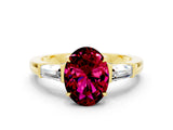 Yellow gold Oval Cut Cut Diamond Ring with Tapered Baguette Side Stones in Four-Prong Setting