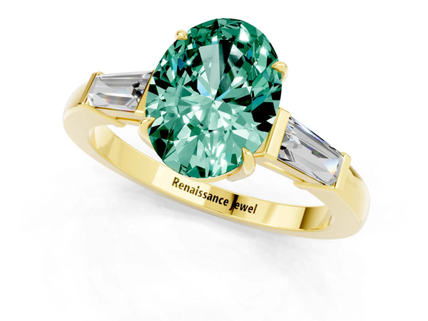 Yellow gold Oval Cut Green Sapphire Three-Stone Ring with Tapered Baguette Side Stones and Prong Setting