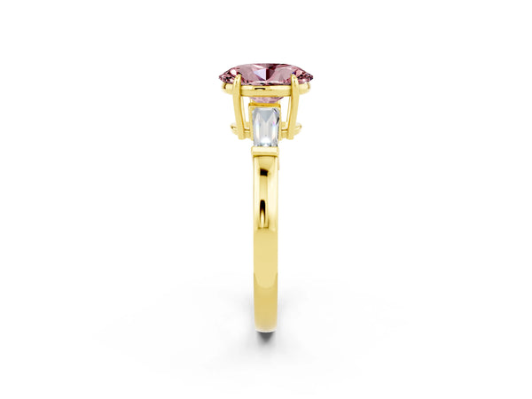 Yellow gold Oval Cut Cut Diamond Ring with Tapered Baguette Side Stones in Four-Prong Setting