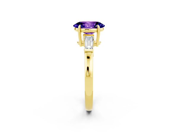 Yellow gold Oval Cut Tanzanite Three-Stone Ring with Tapered Baguette Side Stones and Prong Setting