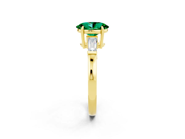 Yellow gold Oval Cut Emerald Three-Stone Ring with Tapered Baguette Side Stones and Prong Setting