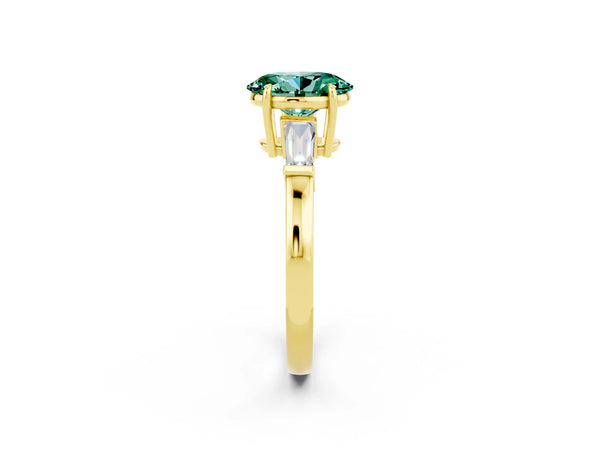 Yellow gold Oval Cut Green Sapphire Three-Stone Ring with Tapered Baguette Side Stones and Prong Setting