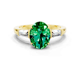 Yellow gold Oval Cut Cut Diamond Ring with Tapered Baguette Side Stones in Four-Prong Setting