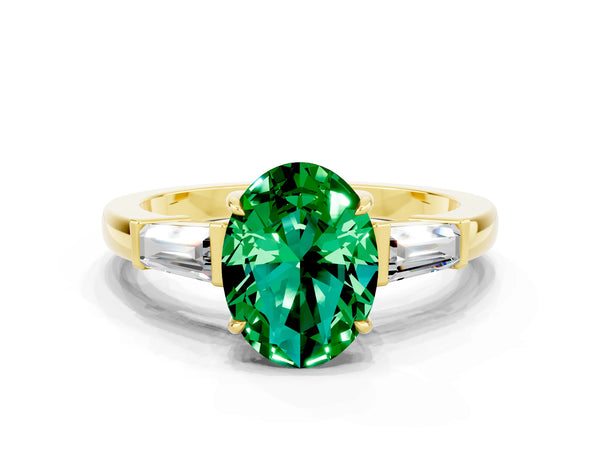 Yellow gold Oval Cut Emerald Three-Stone Ring with Tapered Baguette Side Stones and Prong Setting