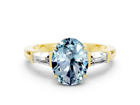 Yellow gold Oval Cut Cut Diamond Ring with Tapered Baguette Side Stones in Four-Prong Setting