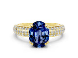 Yellow gold Oval Cut Cut Pave Diamond Engagement Ring with Channel Set Band and Four-Prong Setting