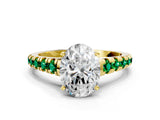 Yellow gold Oval Cut Diamond Cathedral Solitaire Ring with Round with Emerald side stone Pavé Band
