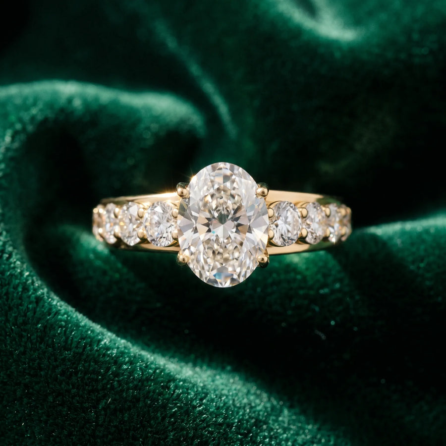 Yellow gold Oval Cut Diamond Engagement Ring with Pavé Band and Four-Prong Setting