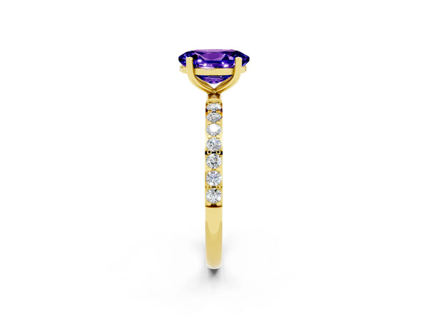 Yellow gold Oval Cut Tanzanite Solitaire Ring with Round Pavé Shoulders and Prong Setting