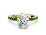 Yellow gold Oval Cut Diamond Pave Band Solitaire Ring with Round with Emerald side stone and Prong Setting