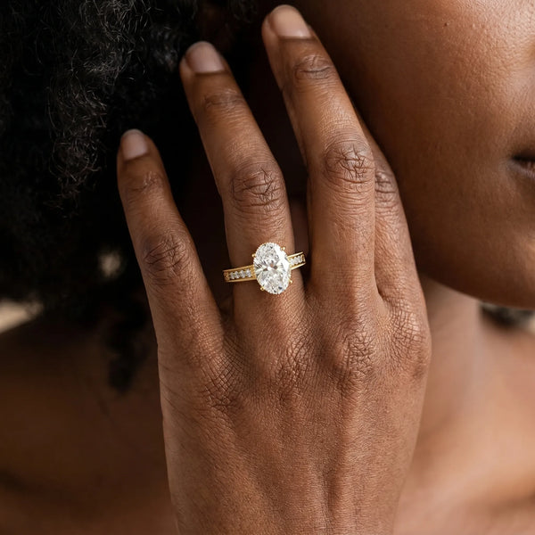 Yellow gold Oval Cut Diamond Ring with Milgrain Pavé Band and Four-Prong Setting