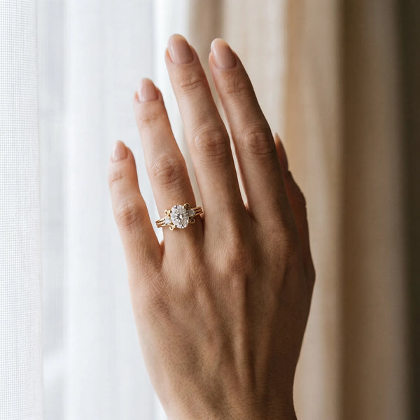 Yellow gold Oval Cut Diamond Ring with Scrollwork Band and Prong Setting