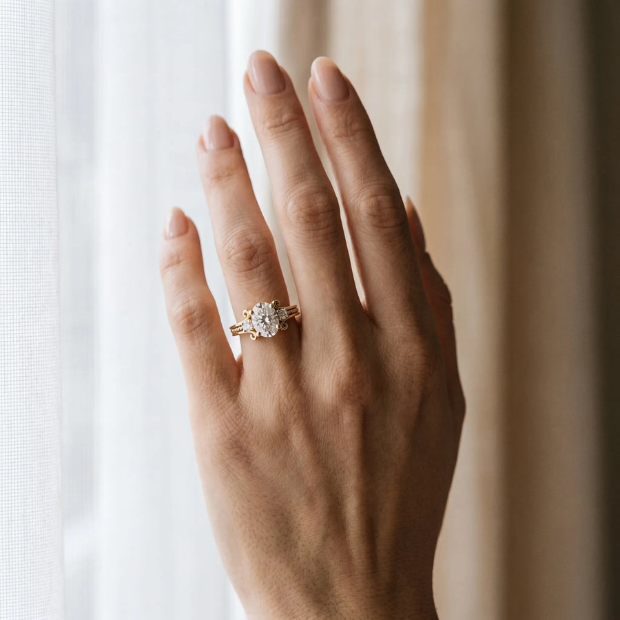 Yellow gold Oval Cut Diamond Ring with Scrollwork Band and Prong Setting