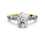 Yellow gold Oval Cut Diamond Side Stone Solitaire Ring with Round with Aquamarine side stone and Four-Prong Setting