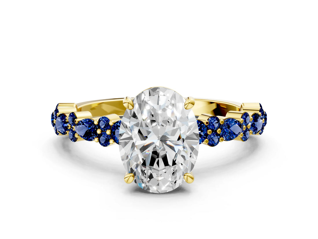Yellow gold Oval Cut Diamond Side Stone Solitaire Ring with Round with Blue Sapphire side stone and Four-Prong Setting
