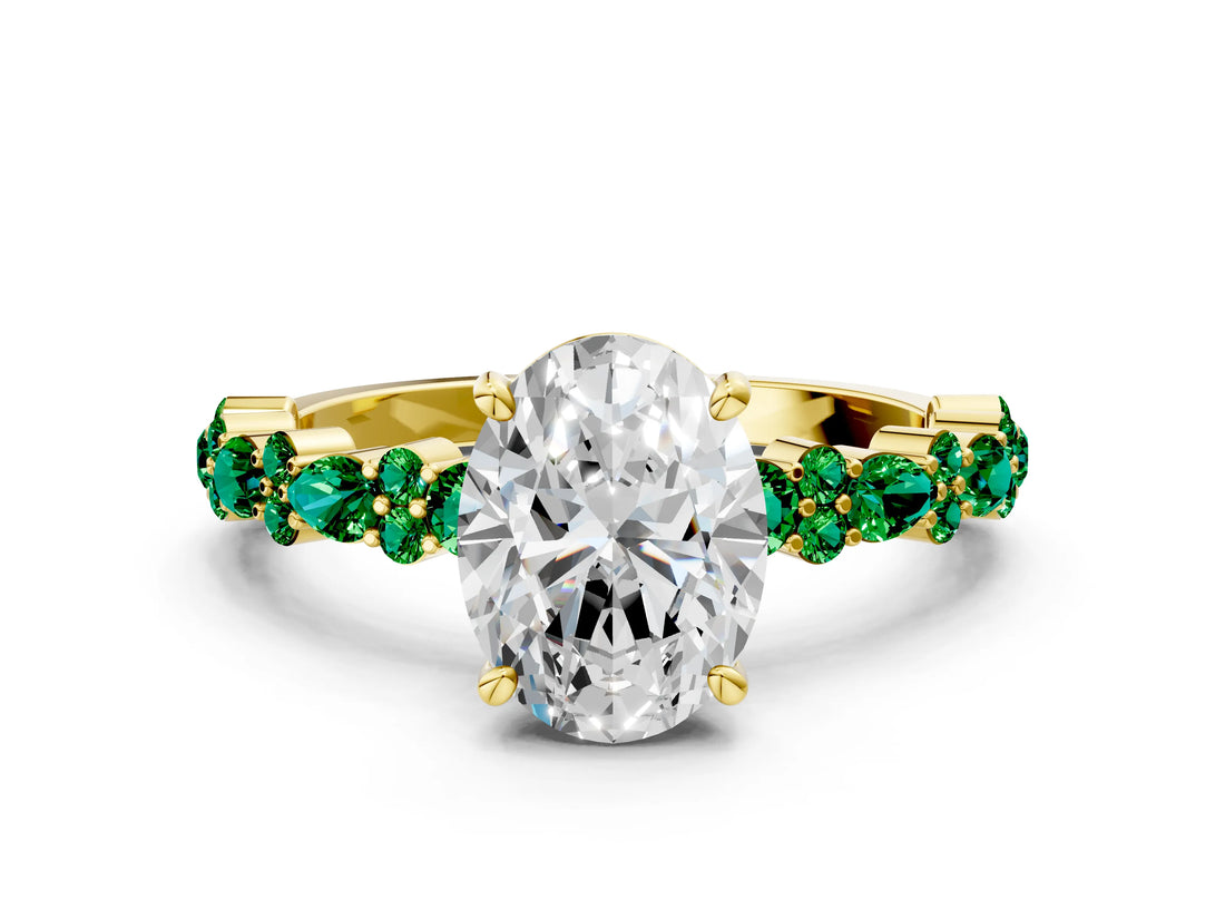 Yellow gold Oval Cut Diamond Side Stone Solitaire Ring with Round with Emerald side stone and Four-Prong Setting