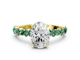Yellow gold Oval Cut Diamond Side Stone Solitaire Ring with Round with Green Sapphire side stone and Four-Prong Setting