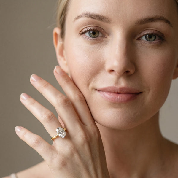 Yellow gold Oval Cut Diamond Solitaire Engagement Ring with Cathedral Setting and Four-Prong Mount