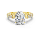 Yellow gold Oval Cut Diamond Solitaire Engagement Ring with Pavé Band and Four-Prong Setting
