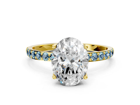 Yellow gold Oval Cut Diamond Solitaire Engagement Ring with Round with Aquamarine side stone Pavé Band and Prong Setting
