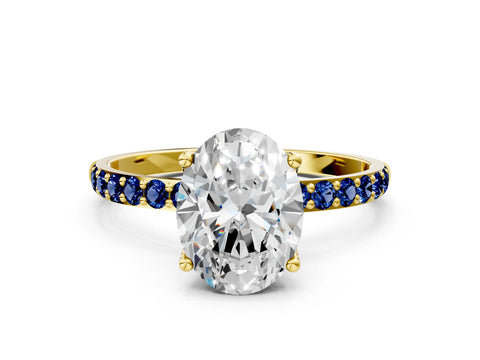 Yellow gold Oval Cut Diamond Solitaire Engagement Ring with Round with Blue Sapphire side stone Pavé Band and Prong Setting