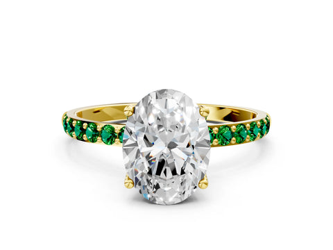 Yellow gold Oval Cut Diamond Solitaire Engagement Ring with Round with Emerald side stone Pavé Band and Prong Setting