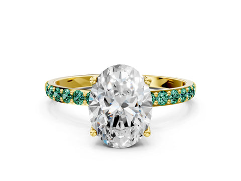 Yellow gold Oval Cut Diamond Solitaire Engagement Ring with Round with Green Sapphire side stone Pavé Band and Prong Setting