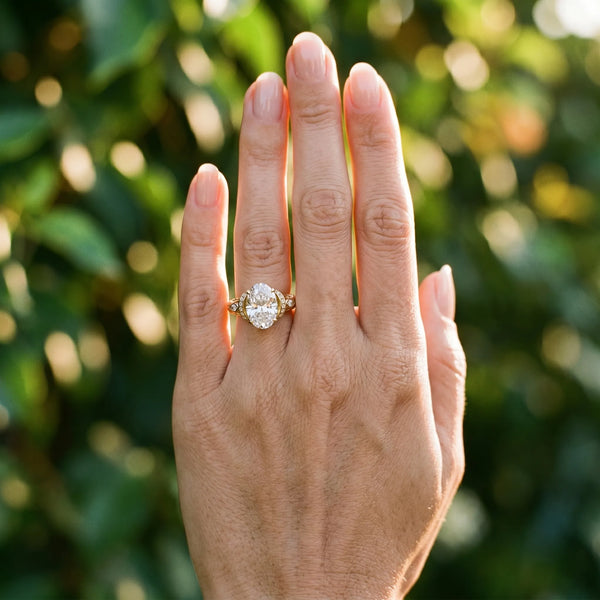 Yellow gold Oval Cut Diamond Solitaire Ring with Filigree Band and Four-Prong Setting