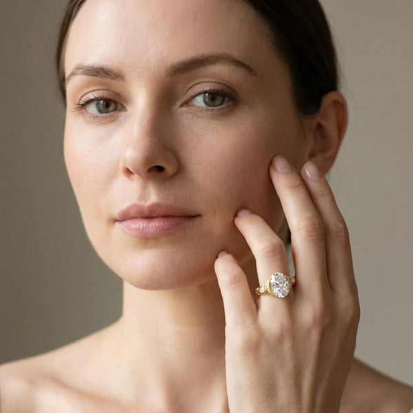 Yellow gold Oval Cut Diamond Solitaire Ring with Filigree Band and Four-Prong Setting