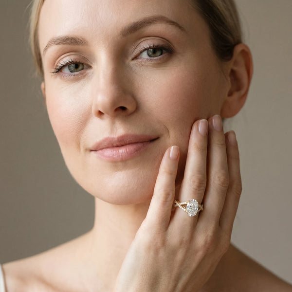 Yellow gold Oval Cut Diamond Solitaire Ring with Four-Prong Setting and Twisted Pavé Band
