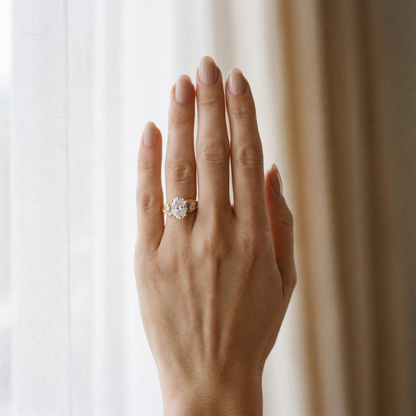 Yellow gold Oval Cut Diamond Solitaire Ring with Milgrain Pavé Band and Four-Prong Setting