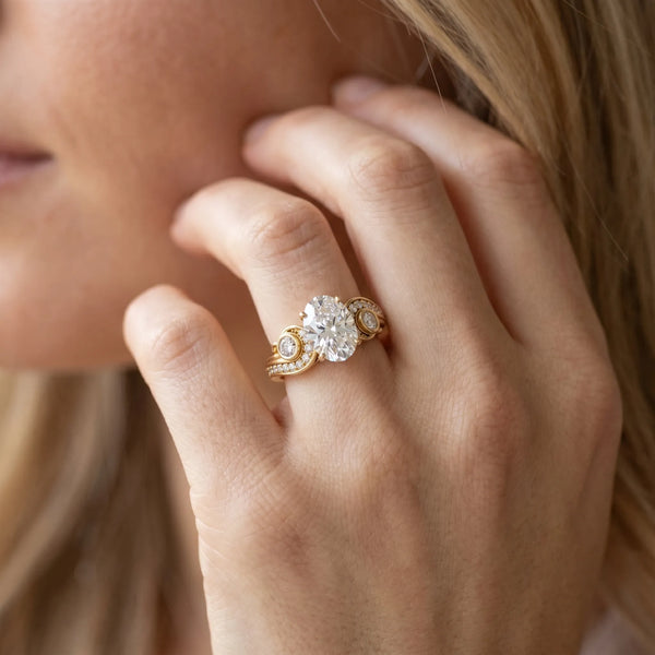 Yellow gold Oval Cut Diamond Solitaire Ring with Milgrain Pavé Band and Four-Prong Setting