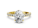 Yellow gold Oval Cut Diamond Solitaire Ring with Pavé Band and Four-Prong Setting